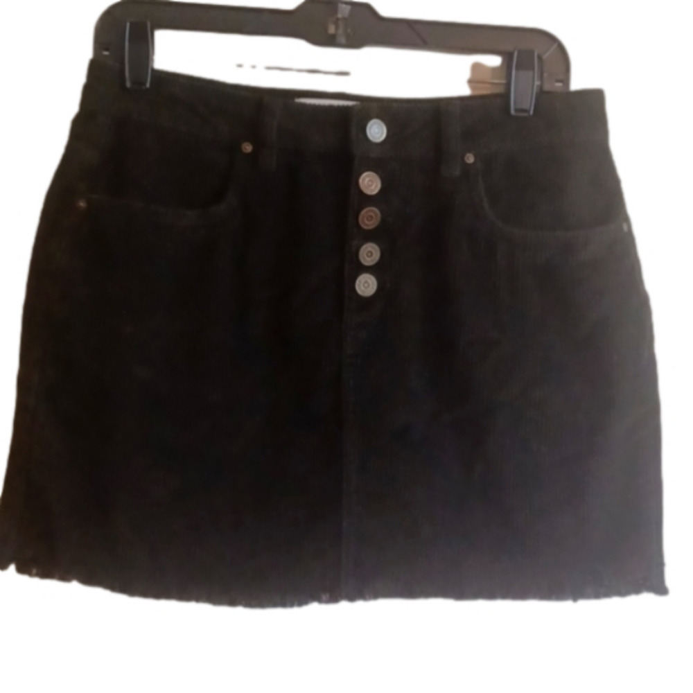 Indigo Rein corduroy skirt.Cute buttonfly type buttons, frayed hem . Size 7.
